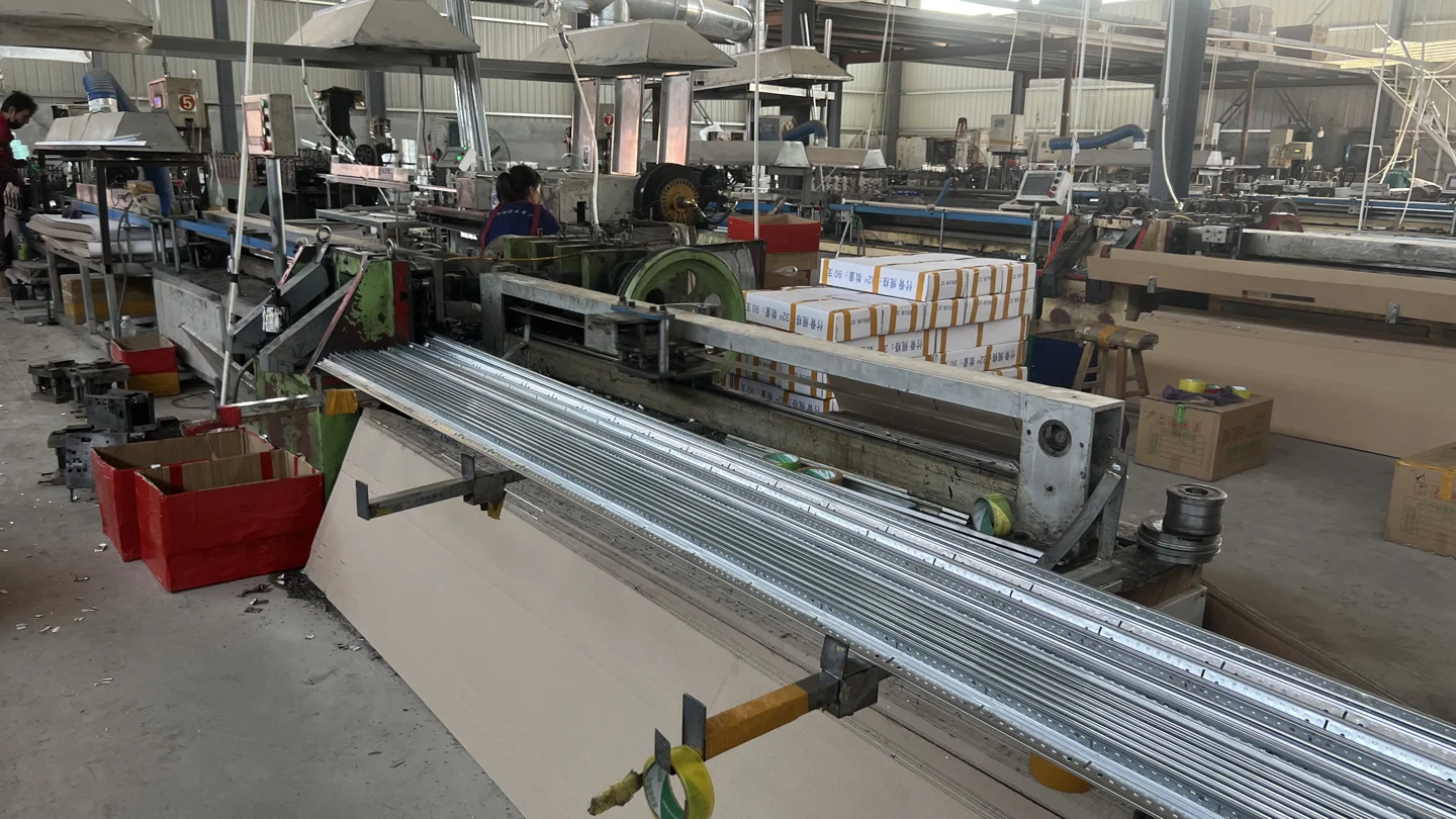 Metal profile forming equipment and long profiles in the supplied workshop photograph